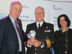 Reserves Minister Julian Brazier of the UKHO presenting the award to Rear Admiral Patricio Carrasco (centre) and his wife Mrs Maria S. Figari