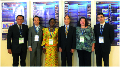 From left to right: Norhizam Hassan (Year 8), Kentaro Kaneda (Year 5), Eunice Tetteh (Year 9), VAdm Shin Tani (GEBCO Chairman), Rochelle Wigley (Year 4) and Naoto Ujihara (Year 6) in front of the Nippon Foundation / GEBCO Postgraduate Certificate in Ocean Bathymetry poster display for the Capacity Building Poster Exhibition at the 5th EIHC